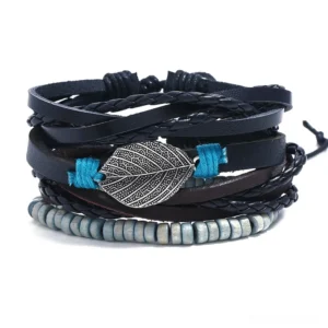 Gothic leather bracelet set flat lay featuring multi-layered bangles with antique silver feather charm, natural wooden beads, and blue cord accents