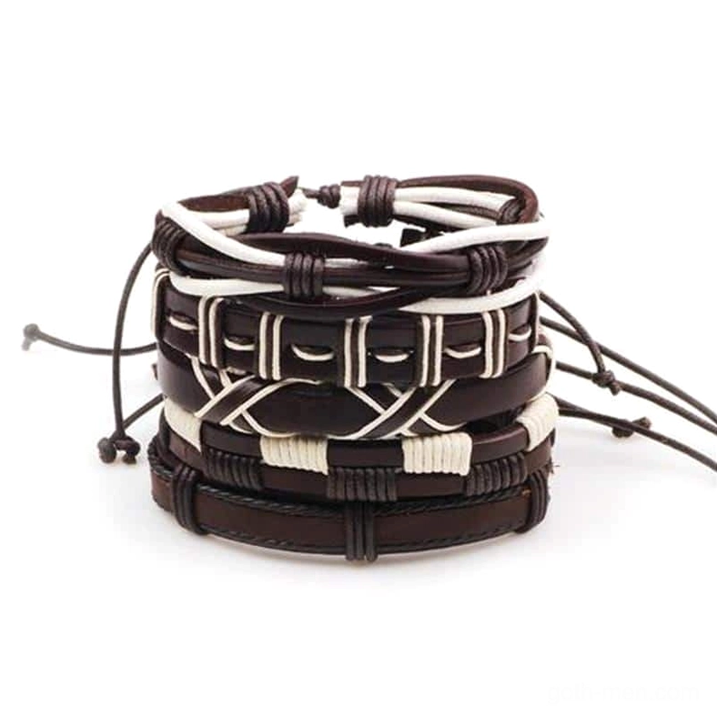 Five-piece gothic braided leather bracelet set in brown and white, overhead view showing woven geometric patterns and adjustable drawstring closures