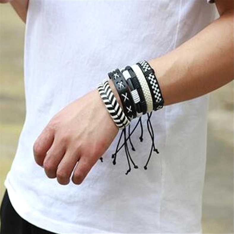 Gothic leather bracelet set worn on male model's left wrist showing adjustable cord details and side profile