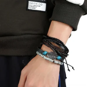 Men's gothic leather bracelet set worn on wrist close-up side view studio shot demonstrating layered styling