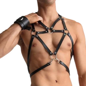 Men's black PU leather chest harness with pentagram metal rings and crisscross straps, front view on muscular model