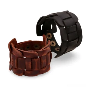 Gothic leather snap cuff bracelet, black and brown woven wristband options, flat lay showcase with brass fasteners