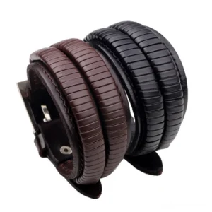 Men's gothic double-wide leather cuff bracelet with embossed leaf pattern, black and brown dual-tone design, adjustable metal buckle, side view