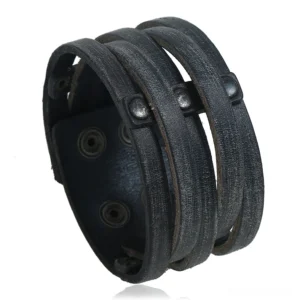 Black distressed leather gothic cuff bracelet with metal rivets and studs - front close-up view showing detailed rivet placement and wide leather design