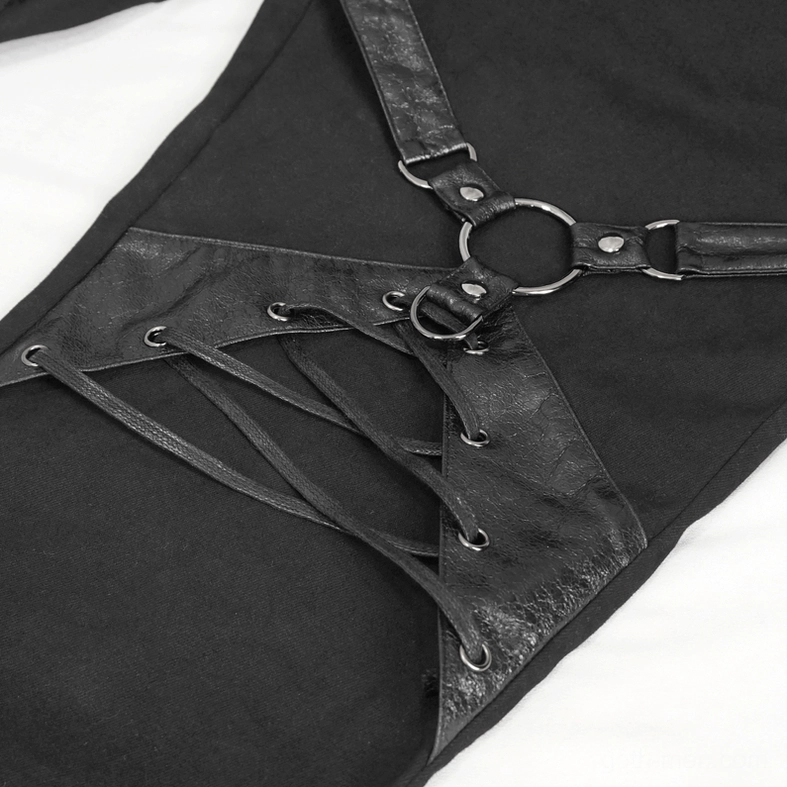 Close-up detail of matte black leather O-ring and lace-up harness strap on thigh