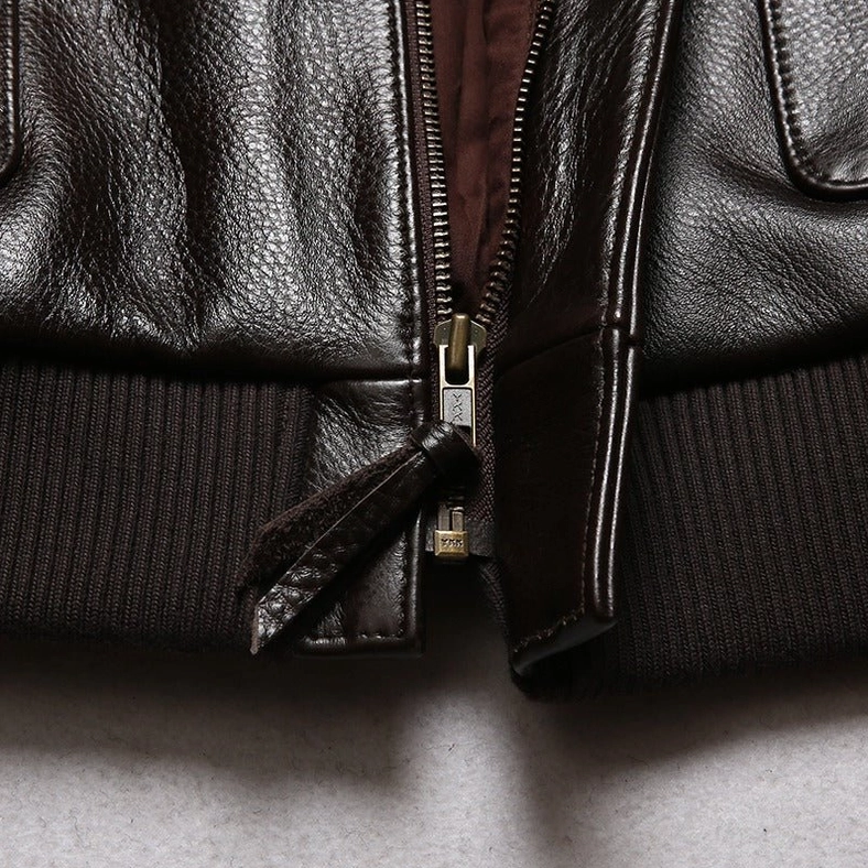 Close-up of embroidered chest graphic on gothic leather flight jacket with detailed thread work