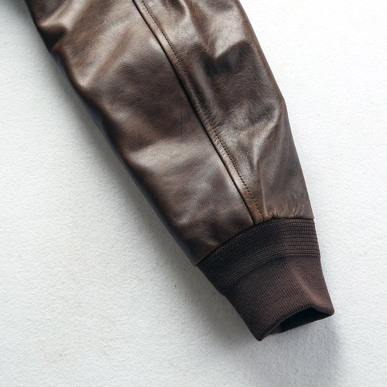 Side profile of men's gothic leather jacket displaying sleeve construction and overall proportions
