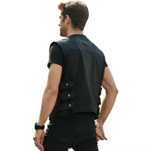Men's black pigskin leather biker vest rear view showing adjustable side straps and sleeveless cut on slim fit model