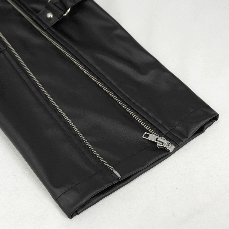 Close-up overhead detail of black faux leather pants hem showing metal zipper closure and matte synthetic leather fabric texture