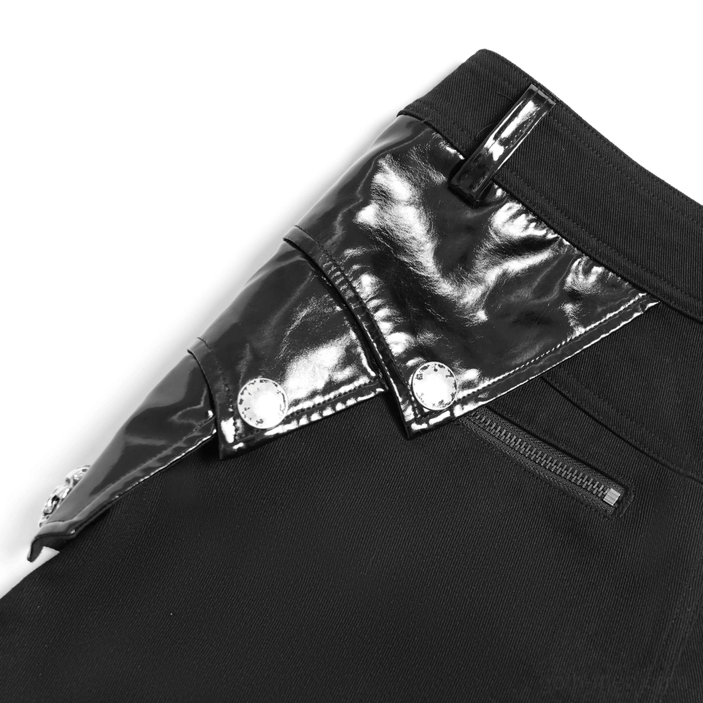 Black gothic trousers with patent leather accents and metal hardware in studio lighting