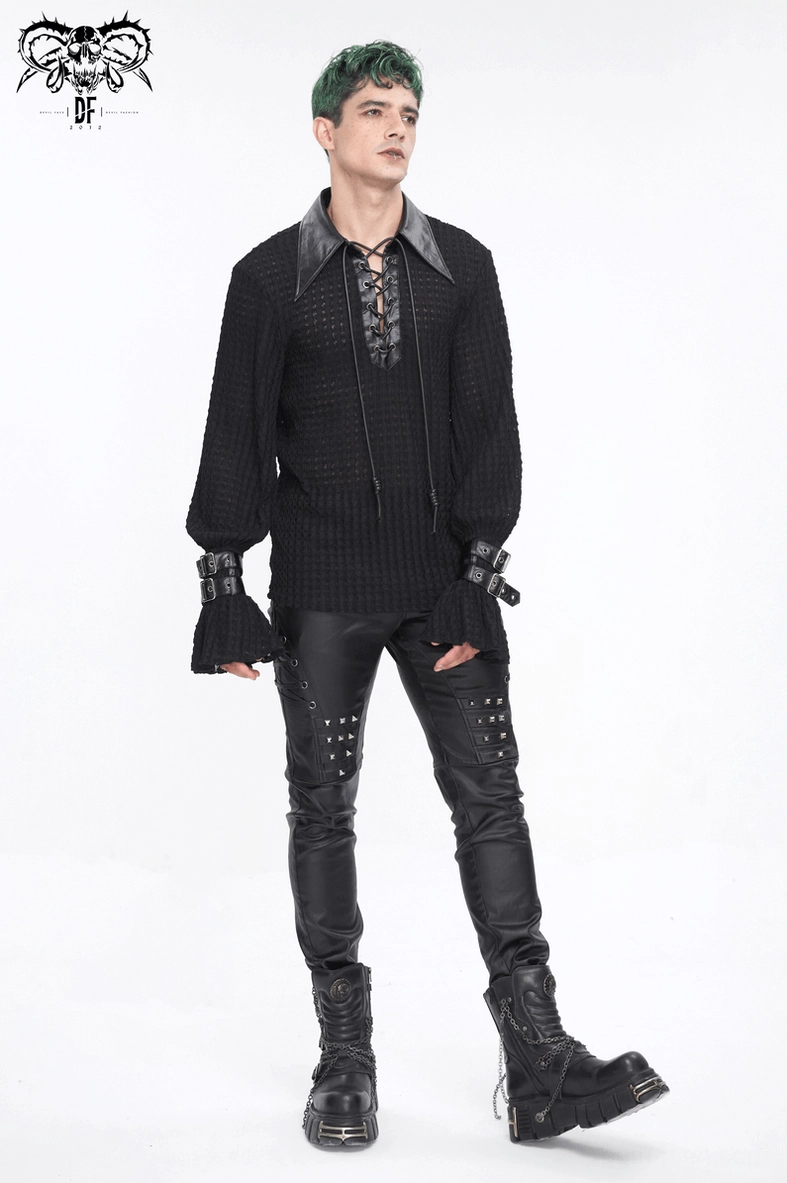 Close-up of black gothic leather texture and stitching on biker pants
