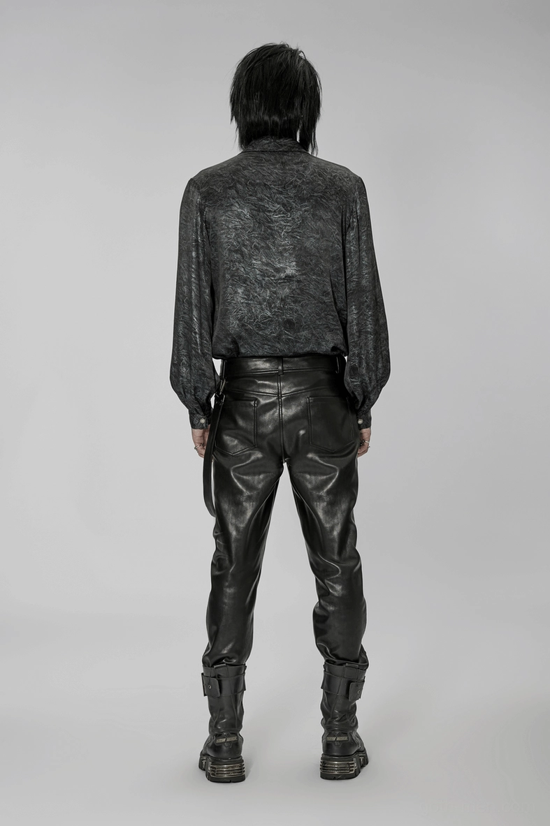 Black gothic leather pants three-quarter view highlighting fitted cut and harness strap design