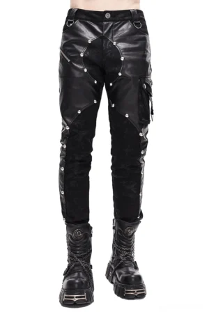 Black gothic leather rivet pants front view on male model - asymmetric faux leather spliced design with metal rivets