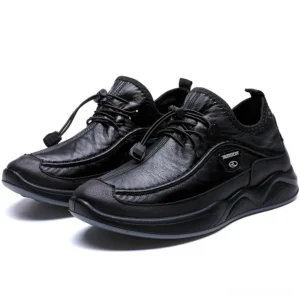 Black leather alternative gothic sneaker with toggle lacing and thick sport sole, front three-quarter view