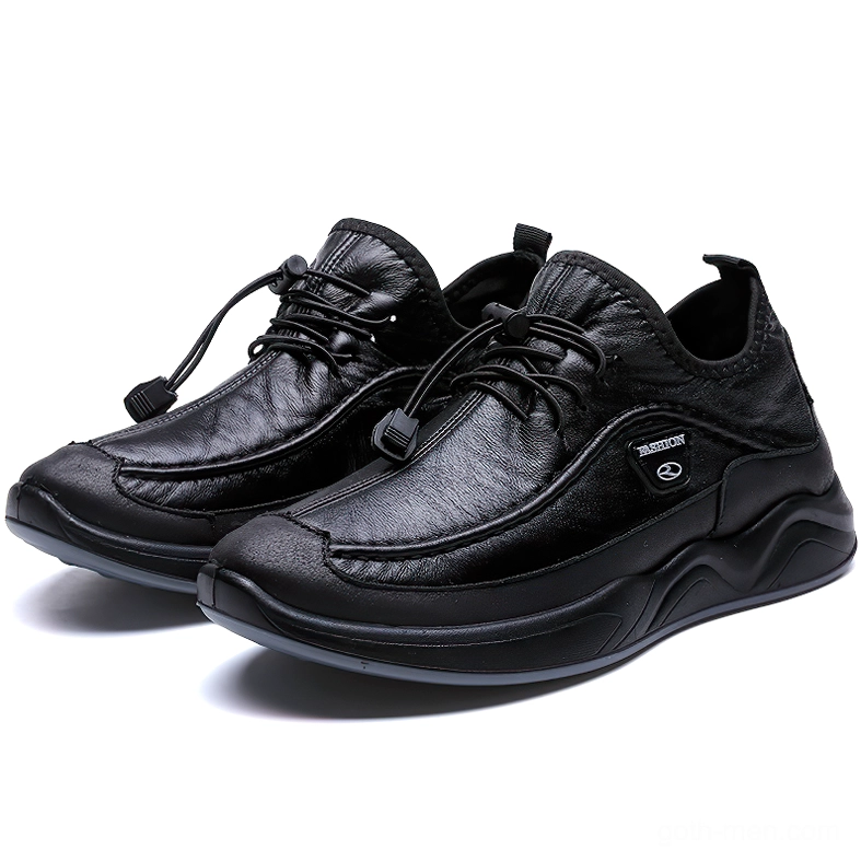 Black leather alternative gothic sneaker with toggle lacing and thick sport sole, front three-quarter view