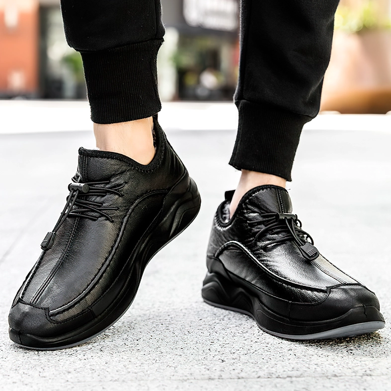 Black leather gothic sneaker styled with black pants in outdoor street scene, casual wear
