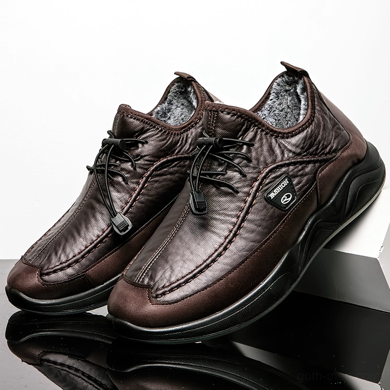 Brown leather gothic sneaker with fuzzy high collar and toggle lacing system, side view