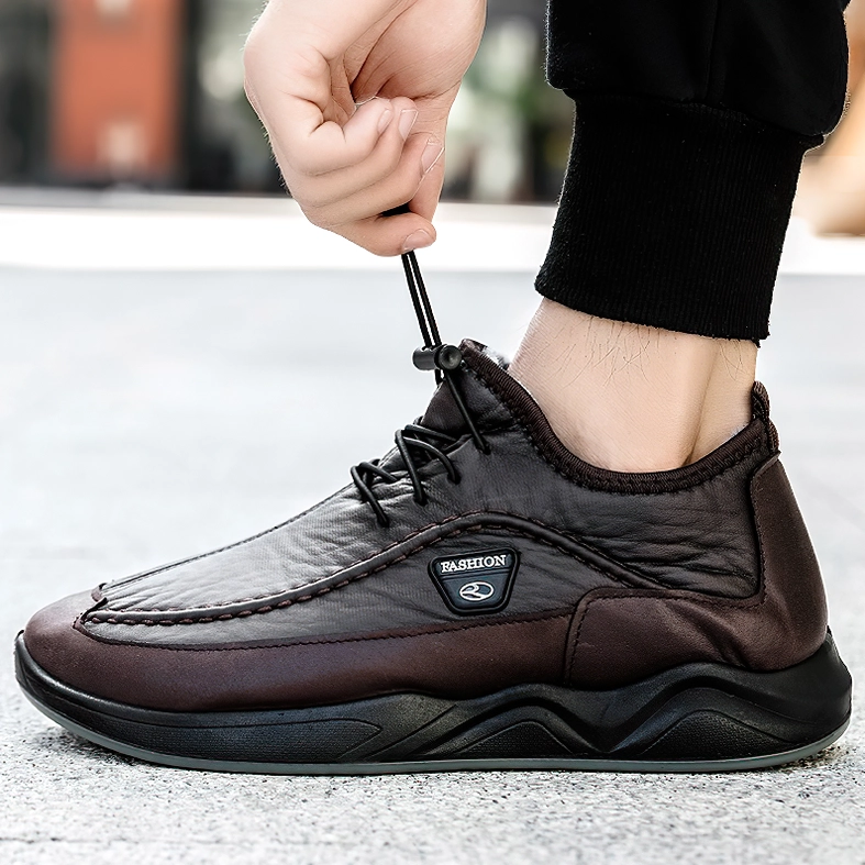 Brown leather alternative gothic sneaker with adjustable toggle lace and branded patch, outdoor styling