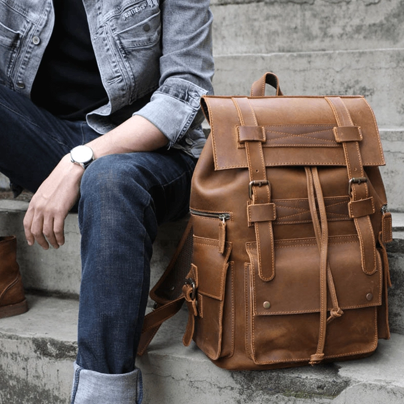 Gothic leather travel backpack with organizational architecture and functional pocket design