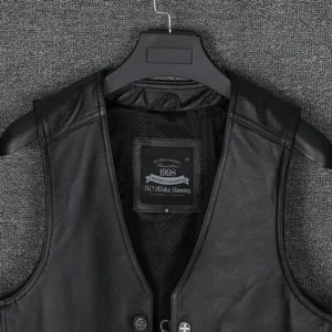 Black genuine leather gothic waistcoat displayed on hanger, front view showing metal snap fasteners, grain leather texture, and collarless design