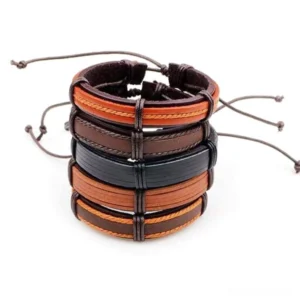 5-piece brown leather gothic wristband set stacked overhead flat lay view with adjustable rope chain details