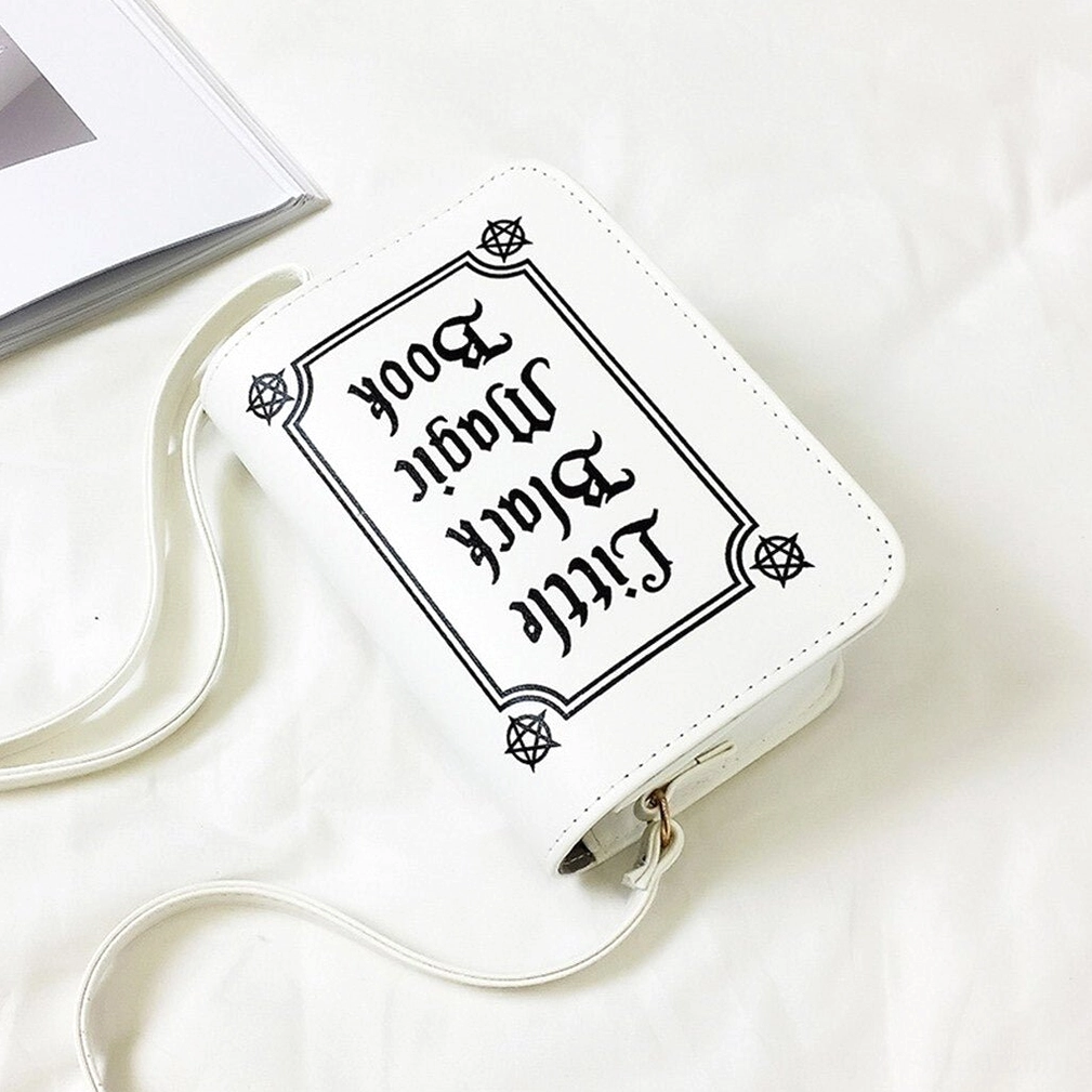 Front flat lay view of gothic letter crossbody bag with pentagram corner decorations on white background