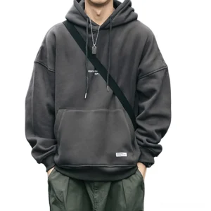 Dark gray gothic letter fleece hoodie with drawstring hood front view on male model