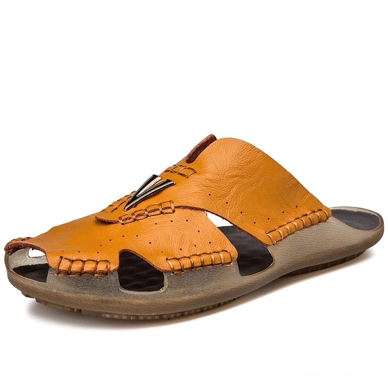 Light tan gothic men's leather slide sandal with hand-stitched edges and non-slip rubber outsole