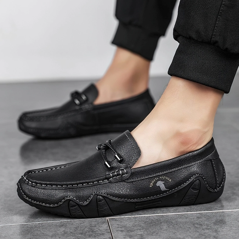 Dark aesthetic mens slip-on loafers showing minimalist silhouette and refined construction