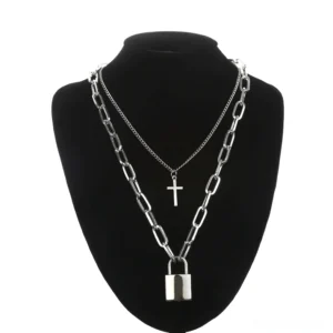 Gothic layered silver chain necklace with square lock and cross pendants displayed on black mannequin - front view