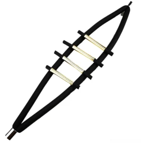 Flat lay overhead view of gothic rubber bracelet with magnetic clasp, black silicone straps and metallic gold accent bars on white background