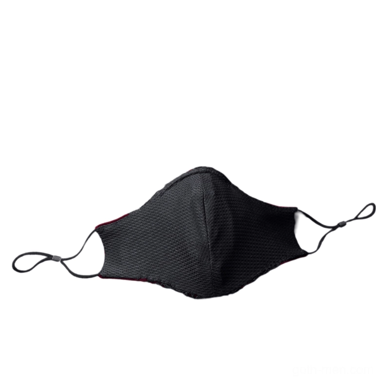 Reversible black textured Gothic mask flat lay front view displaying the solid velvet fabric reverse side