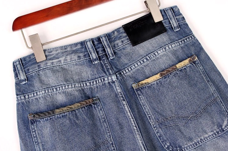 Baggy denim capris worn styling shot - loose fit knee-length alternative goth streetwear