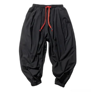 Mens loose gothic harem pants flat lay product display black cotton linen texture with red waist drawstring