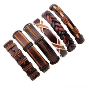 Assorted gothic brown leather wristbands collection flat lay showing mixed woven and solid styles