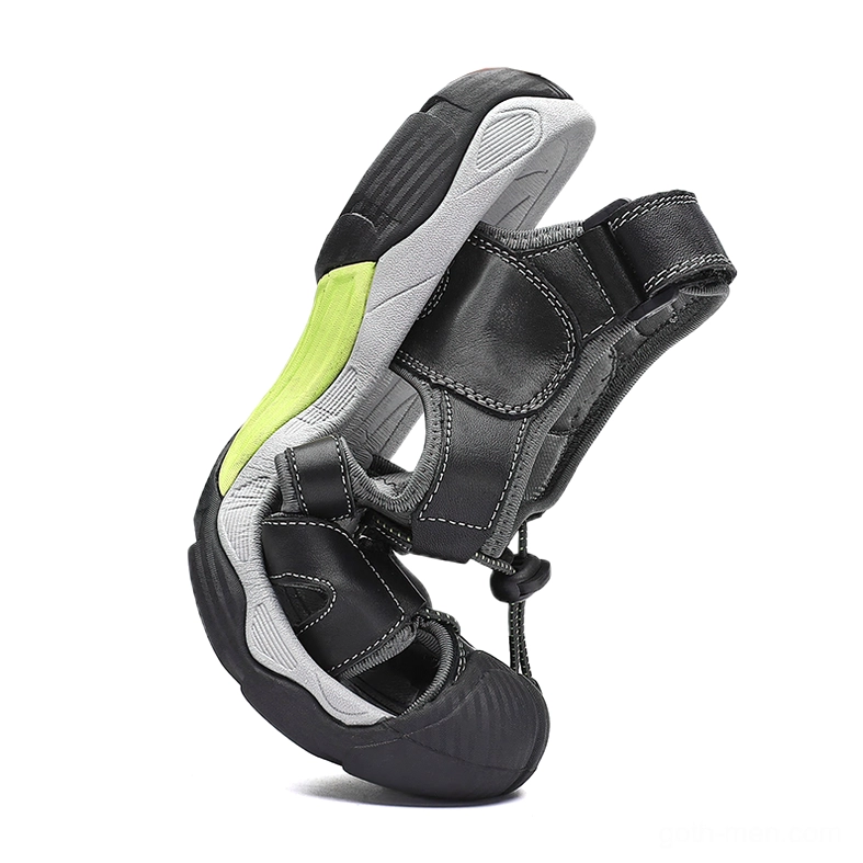 Black gothic men's sandals side and bottom view showing flexible soft rubber outsole construction