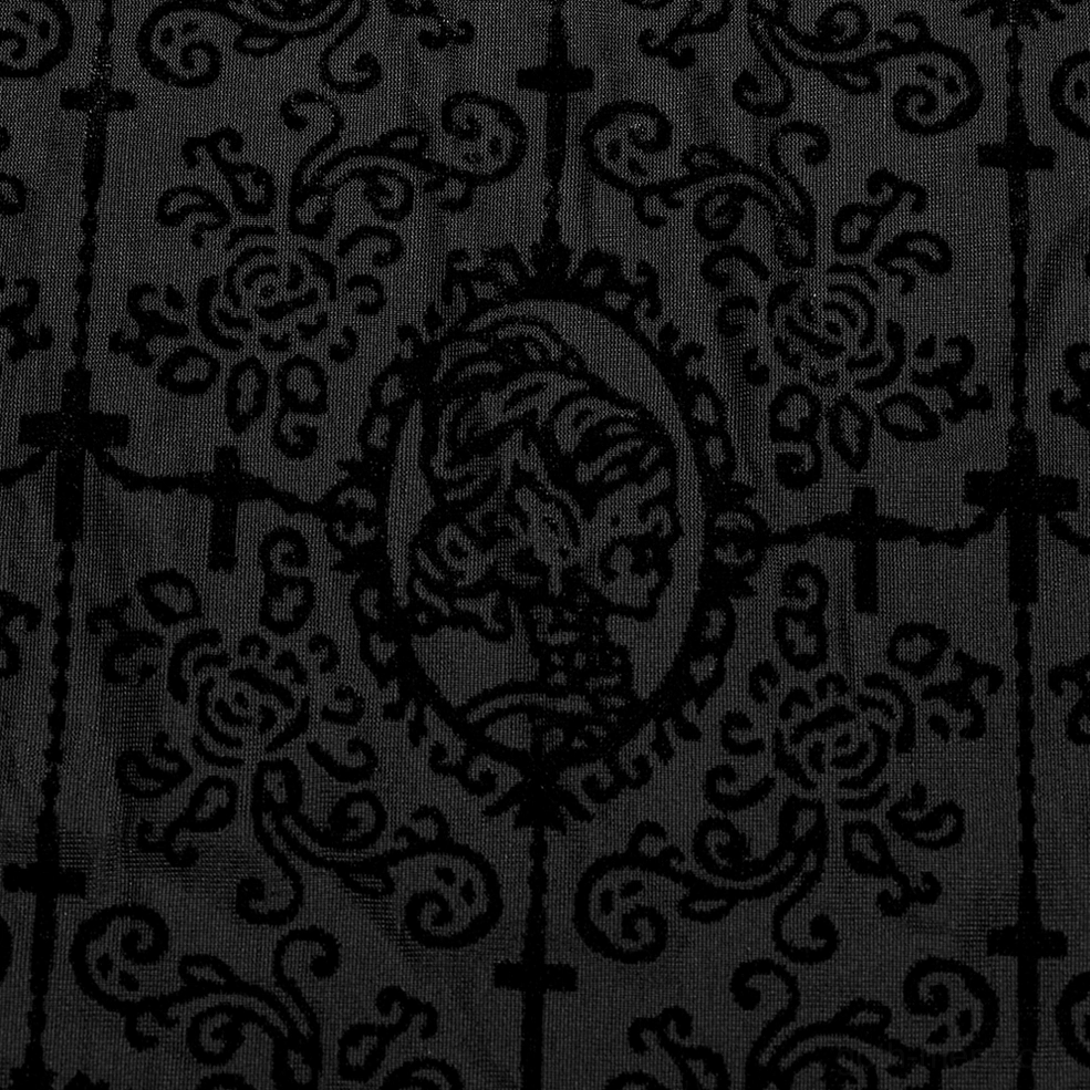 Fabric close-up of black mesh with flocked cross and skull cameo motif dark print design