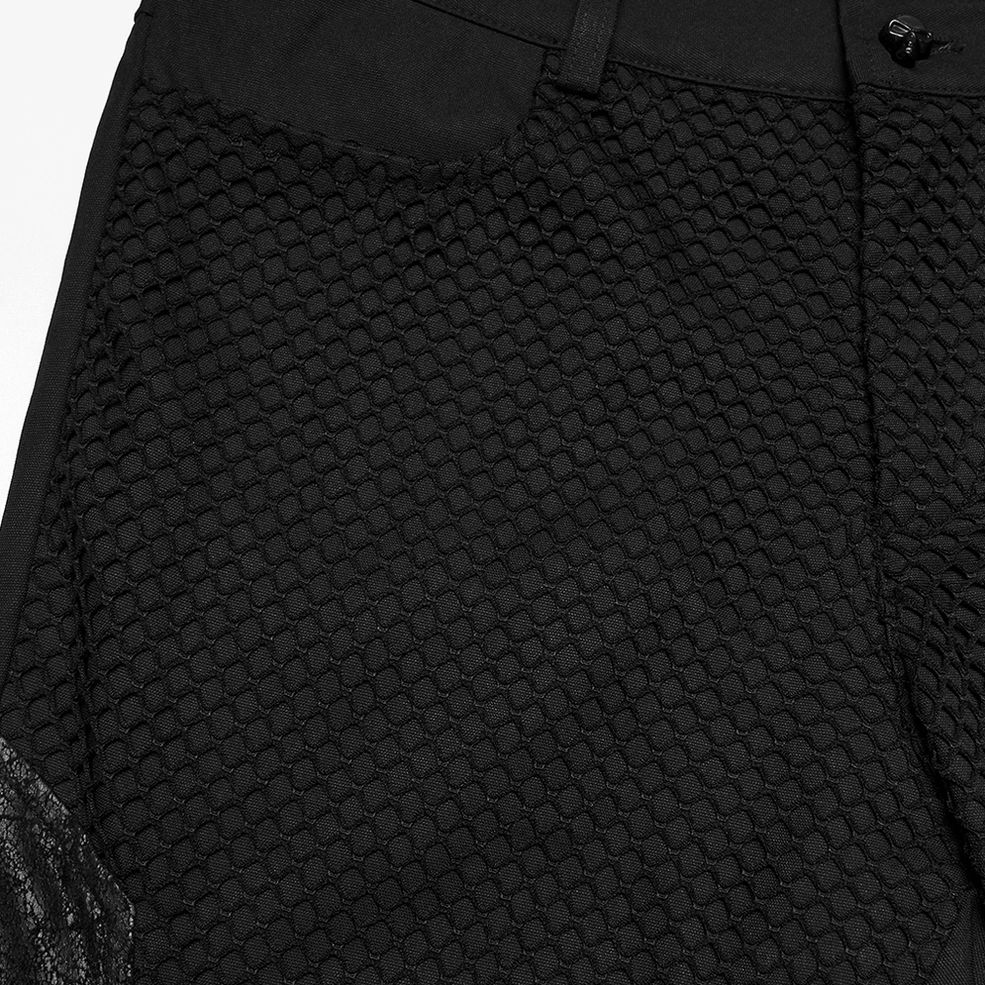 Close-up of black gothic pants waistband and front pocket with honeycomb mesh fabric