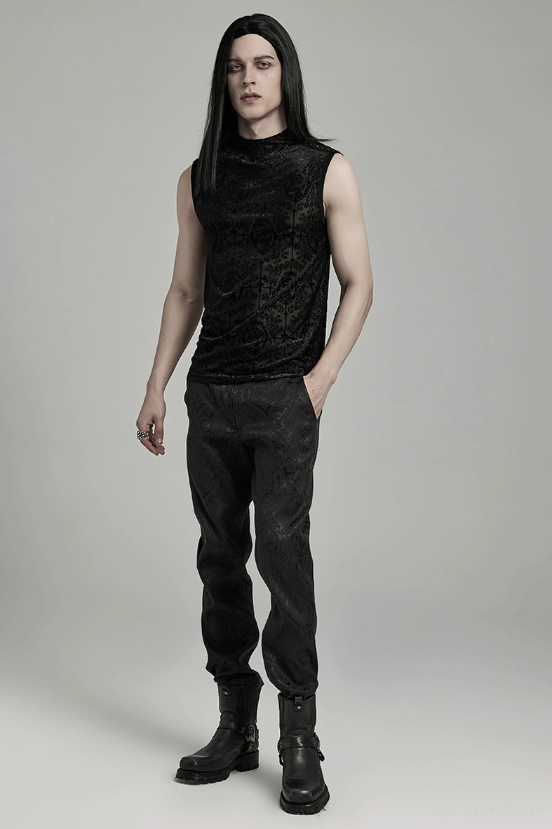 Full body side view of black gothic mesh tank worn with dark pants and boots complete styling