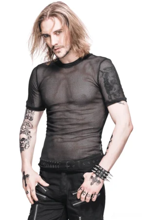 Tattooed male model wearing black sheer mesh gothic t-shirt in three-quarter front view, slim fitted silhouette in studio setting