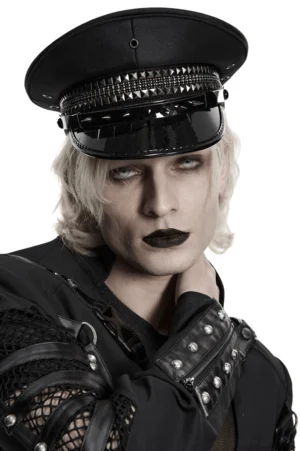 Gothic studded military cap frontal view on model, black glossy visor with metal spike details, alternative fashion headwear