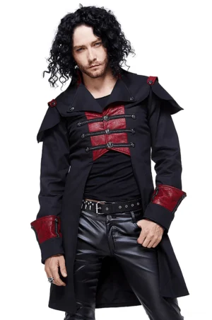 Black and red slim fit gothic military cape coat front view on male model, stand collar design with metal toggle buttons and red shoulder accent straps