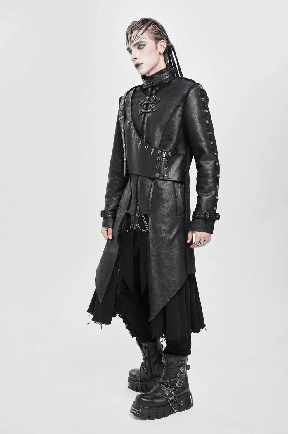Military gothic long coat front view with spiked shoulders on styled alternative fashion model