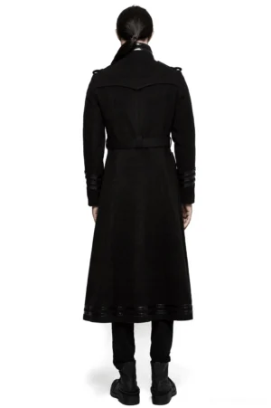 Back view of asymmetric gothic military coat showing rear silhouette, high stand collar, and back belt detail on model