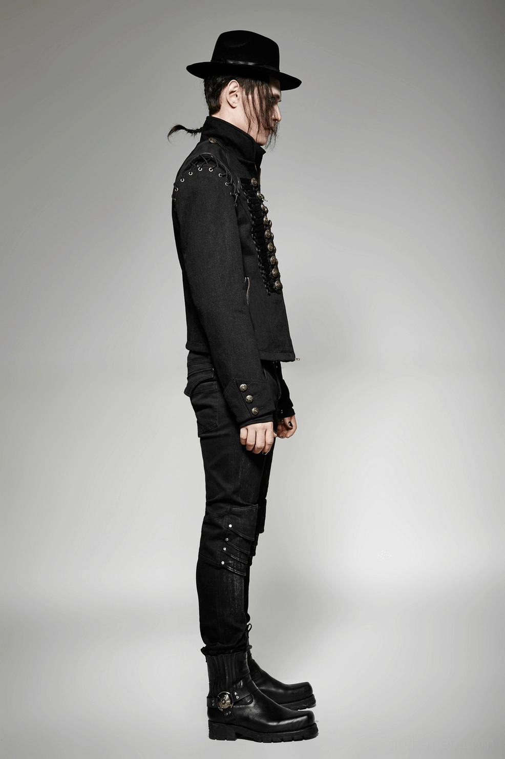 Gothic military jacket three-quarter view highlighting structured shoulders, textured materials, and industrial hardware