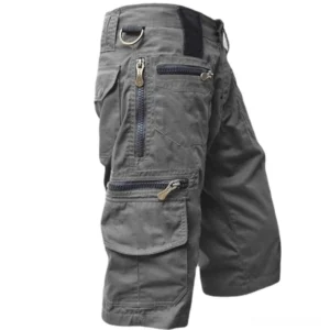 Dark gray calf-length military cargo shorts with D-ring waist detail and tactical pockets, left side profile