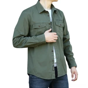 Styled look of olive gothic military cotton shirt paired with denim jeans and casual accessories on male model