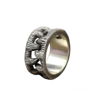 Gothic monster teeth ring side view showing textured chain-link construction and polished inner band detail