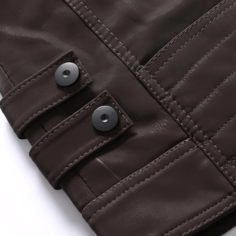 Adjustable snap fastener strap detail on gothic motorcycle jacket sleeve cuff with topstitching and metal hardware