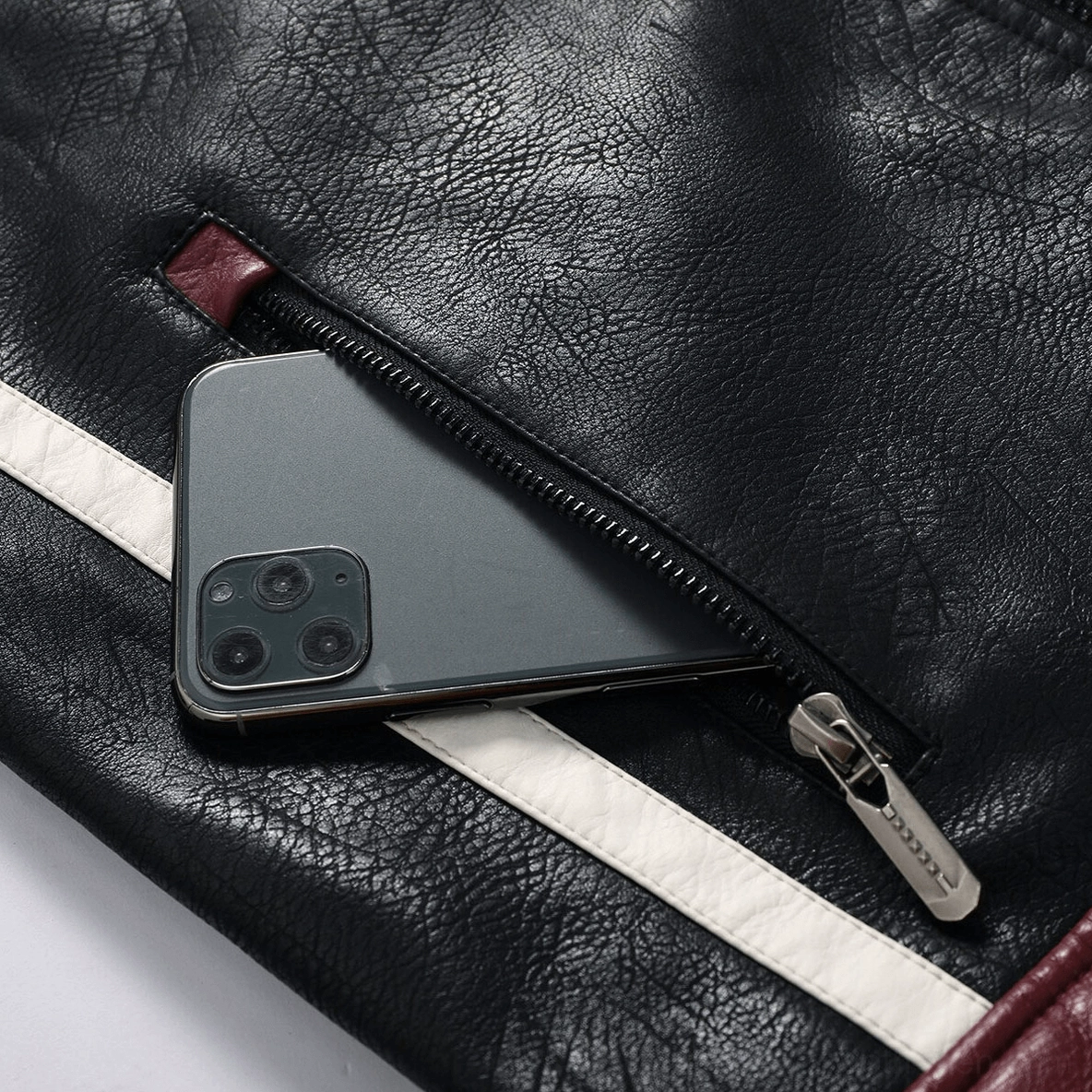 Flat lay detail view of gothic biker jacket showing overall construction and material quality